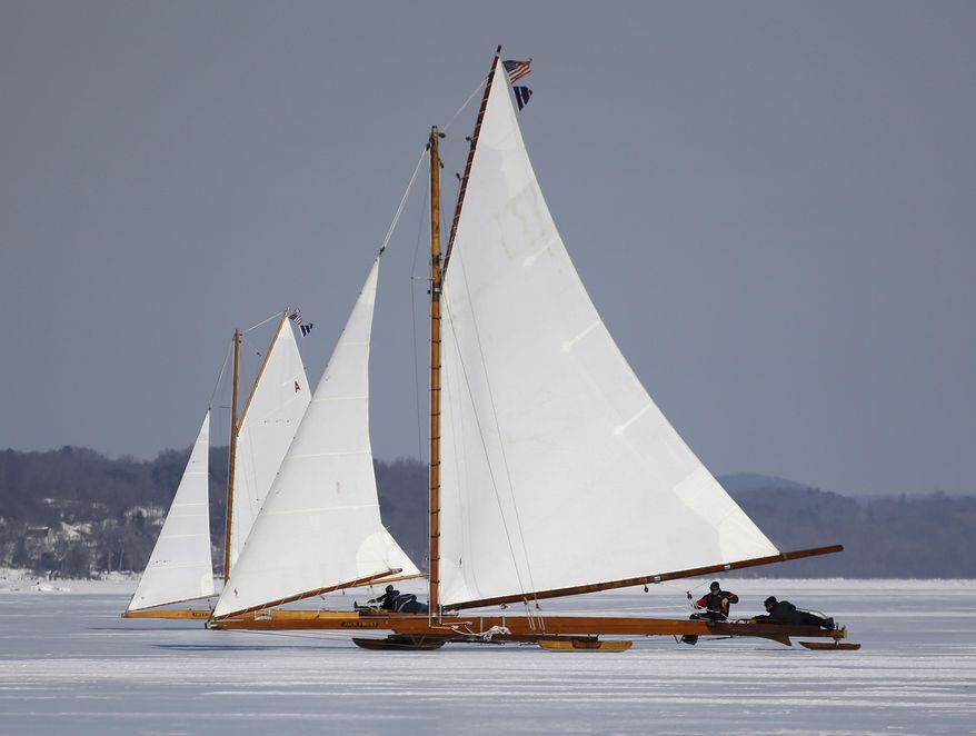 The ice boats Jack Frost, near, and Ariel sail along the Hudson River on Saturday, March 1, 2014, in Barrytown, N.Y. More than a dozen boats hit the ice last weekend on a wide stretch of the river about 100 miles north of New York City. (AP Photo/Mike Groll)
