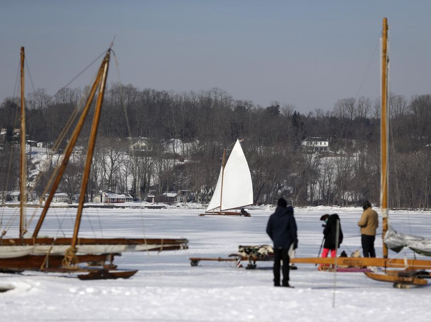 An ice boat sails along the Hudson River on Saturday, March 1, 2014, in Barrytown, N.Y. More than a dozen boats hit the ice last weekend on a wide stretch of the river about 100 miles north of New York City. (AP Photo/Mike Groll)