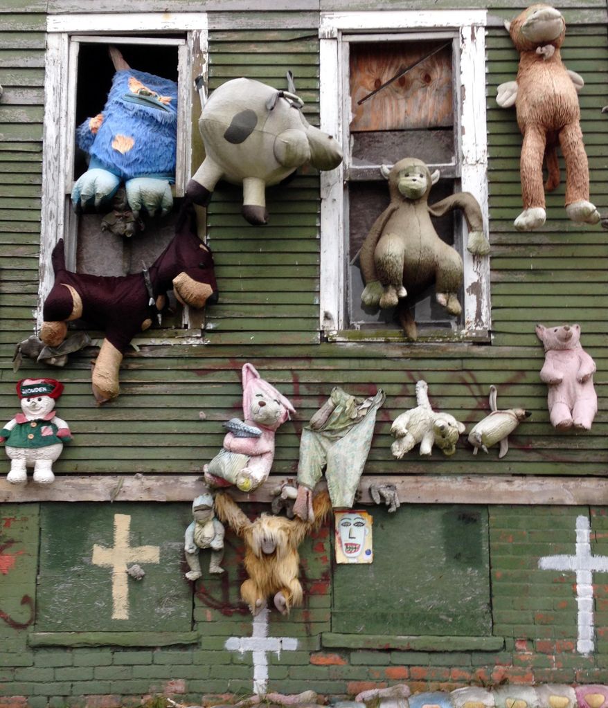 In this Nov. 21, 2013 photo, stuffed animals are seen attached to "The Party Animal House" in the Heidelberg Art Project in Detroit. Another fire has burned a house that's part of the outdoor art installation. WDIV-TV reports that the fire department responded early Friday, March 7, 2014 to the fire on the city's east side that destroyed the building. "The Heidelberg Project has been the target of at least eight earlier suspicious fires. There have been no arrests related to the fires that started in May 2013, but local and federal officials are investigating. Tyree Guyton founded the east-side project in 1986 as a response to urban decay. (AP Photo/Carlos Osorio)