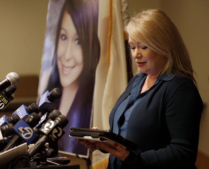 Sheila Pott, mother of Audrie Pott, reads a statement in support of Audrie's Law on Friday, March 7, 2014, in Saratoga, Calif. Audrie’s Law is a legislative proposal aimed at deterring the bullying, cyberbullying, and sexual assault that played roles in the suicide of Audrie Pott, a 15-year-old Saratoga High School student. (AP Photo/Marcio Jose Sanchez)