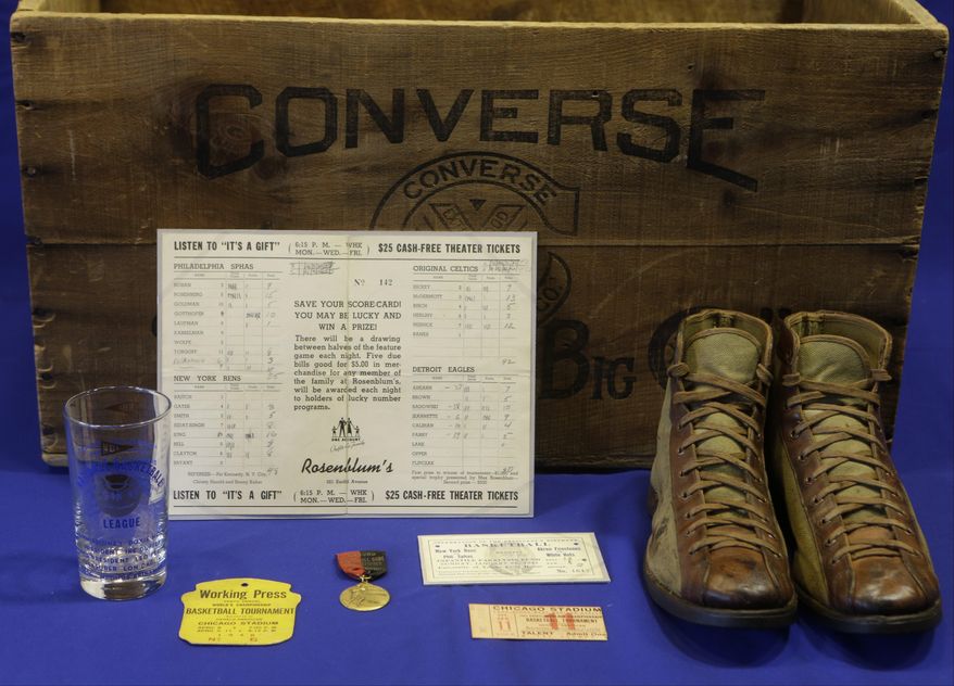 In this Feb. 19, 2014 photo, items to be used as part of an exhibit entitled "The Black Fives," are shown at the New-York Historical Society in New York. Dozens of teams flourished between 1904 and 1950 in what became known as the Black Fives Era, an often-overlooked piece of black history that is the subject of an exhibition opening at the New-York Historical Society on March 14. (AP Photo/Frank Franklin II)