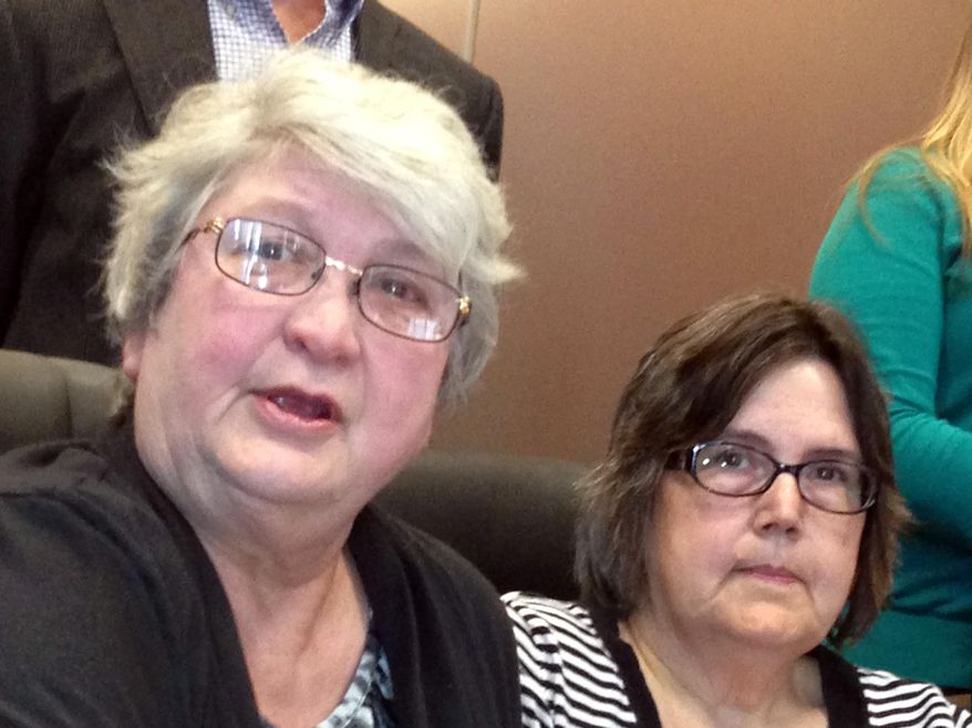 Jo Ann Dale of Otisco, Ind., and her wife, Carol Uebelhoer, discuss a lawsuit filed Friday, March 7, 2014, against the state of Indiana that seeks to overturn a same-sex marriage ban there. The women were married in Massachusetts six years ago and said they want the union recognized by state officials. Three other couples joined in the lawsuit, which was filed Friday in federal court in New Albany, Ind. (AP Photo/Brett Barrouquere)