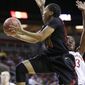 Southern California&#39;s Ariya Crook (14) drives past Stanford&#39;s Chiney Ogwumike in the first half of an NCAA college basketball game in the Pac-12 women&#39;s tournament  Saturday, March 8, 2014, in Seattle. (AP Photo/Elaine Thompson)