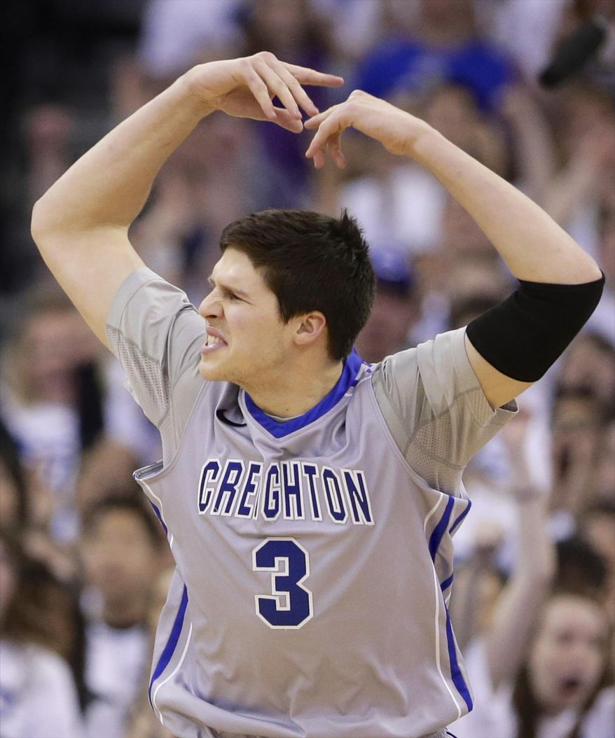 Creighton's Doug McDermott (3) calls for crowd participation in the first half on an NCAA college basketball game against Providence in Omaha, Neb., Saturday, March 8, 2014. (AP Photo/Nati Harnik)