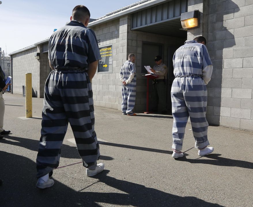 ** FILE ** In this photo taken Thursday, Feb. 20, 2014, convicted felons from Yolo County arrive at the Deuel Vocational Institution in Tracy, Calif. (AP Photo/Rich Pedroncelli)