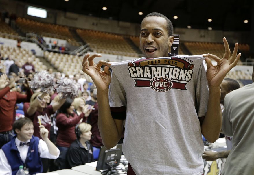 Eastern Kentucky forward Deverin Muff celebrates after Eastern Kentucky defeated Belmont 79-73 in an NCAA college basketball game for the title of the Ohio Valley Conference men's tournament, Saturday, March 8, 2014, in Nashville, Tenn. (AP Photo/Mark Humphrey)