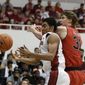 Stanford forward Josh Huestis, left, and Utah center Dallin Bachynski, right, battle for the ball during the first half of an NCAA college basketball game Saturday, March 8, 2014, in Stanford, Calif. (AP Photo/Eric Risberg)