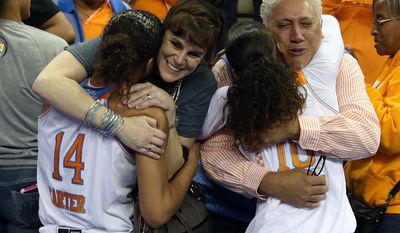Tennessee&#39;s Andraya Carter (14) hugs her mother Jessica Lhamon and Meighan Simmons (10) hugs her father Wayne Simmons after they defeated Texas A&amp;amp;M  86-77 in an NCAA college basketball game in the semifinals of the Southeastern Conference women&#39;s basketball tournament Saturday, March 8, 2014, in Duluth, Ga. (AP Photo/Jason Getz)