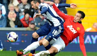 Manchester United&#39;s Robin van Persie   tackles West Brom&#39;s Morgan Amalfitano    during the English Premier League soccer match between West Bromwich Albion and Manchester United at The Hawthorns Stadium in West Bromwich, England, Saturday, March 8, 2014.  (AP Photo/Rui Vieira)
