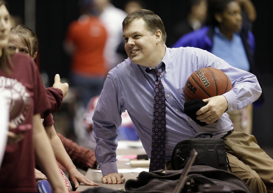 Eastern Kentucky coach Jeff Neubauer talks with fans after Eastern Kentucky defeated Belmont 79-73 in an NCAA college basketball game for the Ohio Valley Conference men's tournament title, Saturday, March 8, 2014, in Nashville, Tenn. AP Photo/Mark Humphrey)