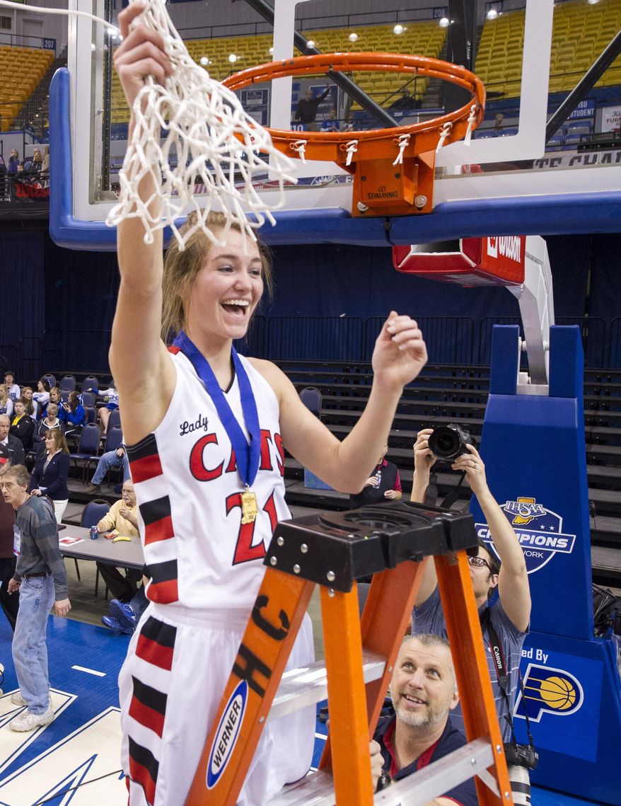 Oregon-Davis High School's Ashley Campbell (21) celebrates after cutting down the game net after the team won the IHSAA Girls Basketball Class A Championships, March 8, 2014, in Terre Haute, Ind. Oregon-Davis defeated Vincennes Rivet 69-64. (AP Photo/Doug McSchooler)