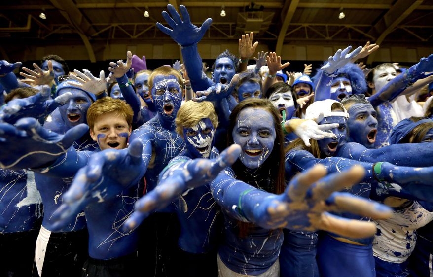 Duke fans cheer prior to the tip-off between Duke and North Carolina in an NCAA college basketball game in Durham, N.C., Saturday, March 8, 2014. (AP Photo/Gerry Broome)
