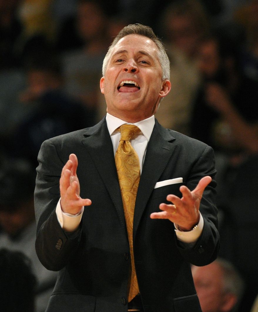 Georgia Tech head coach Brian Gregory disputes a foul call during the first half of an NCAA college basketball game against Virginia Tech Saturday, March 8, 2014, in Atlanta. (AP Photo/David Tulis)