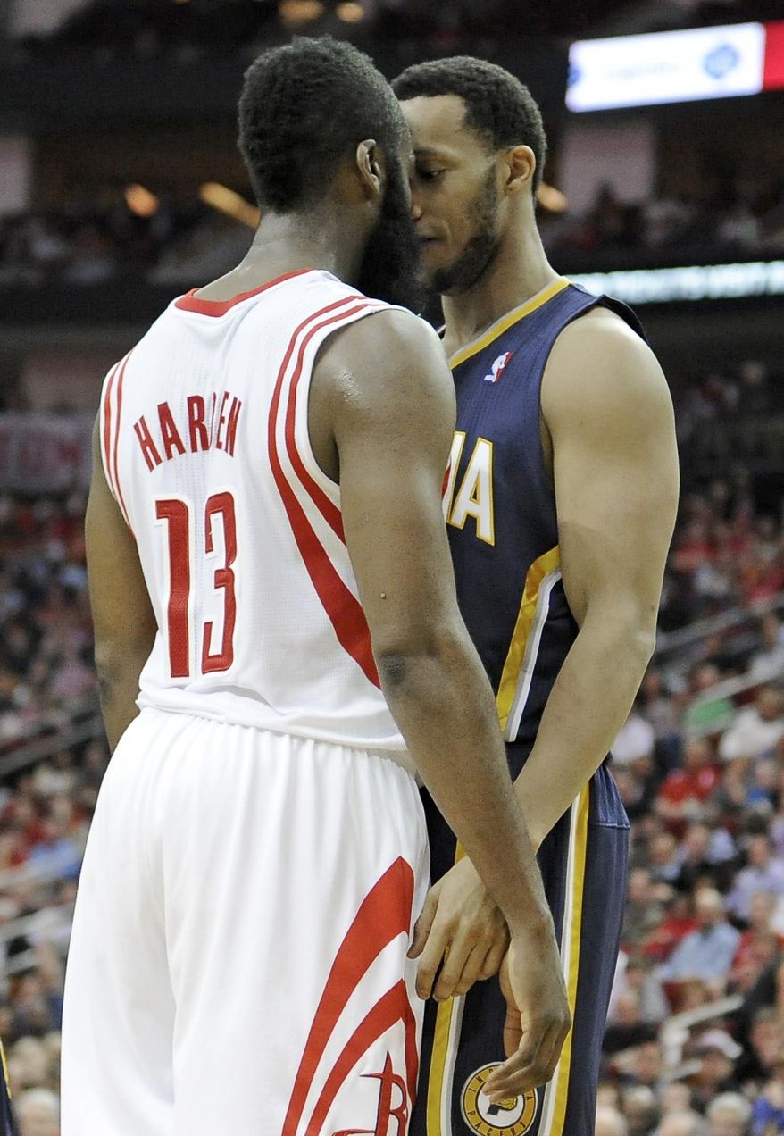 Houston Rockets' James Harden (13) and Indiana Pacers' Evan Turner get in each others' faces in the second half of an NBA basketball game on Friday, March 7, 2014, in Houston. Both players received double technical fouls for the confrontation that included shoving. (AP Photo/Pat Sullivan)