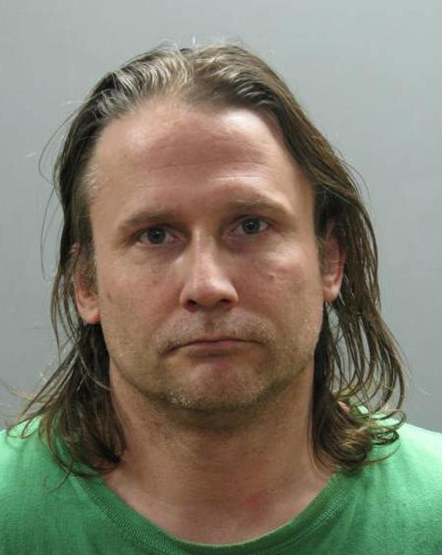 In this March 7, 2014, photo provided by the Nassau County Police Department in Mineola, N.Y., Jonathan Roman is shown. Roman, 41, of Coram, N.Y., has been charged with second degree murder for killing his 71-year-old uncle, John Frankowski. Frankowski’s body was found buried in a wooded area near Roman’s home. (AP Photo/Nassau County Police Department)