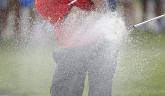 Patrick Reed hits from an eighth hole sand trap during the final round of the Cadillac Championship golf tournament on Sunday, March 9, 2014, in Doral, Fla. (AP Photo/Wilfredo Lee)