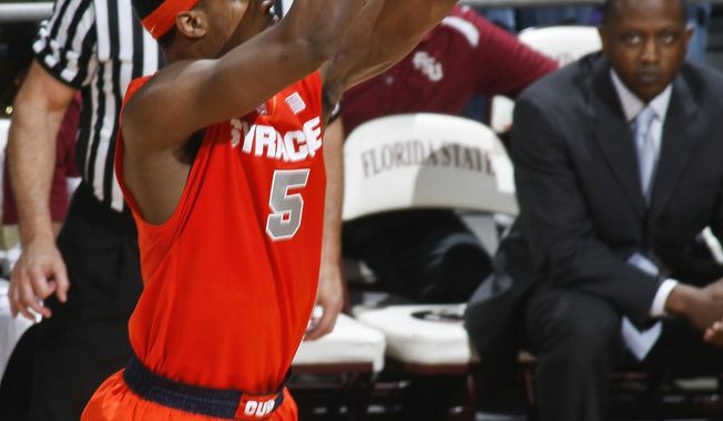 Syracuse forward C.J. Fair (5) makes a 3-point basket in the first half of an NCAA college basketball game against Florida State, Sunday, March 9, 2014, in Tallahassee, Fla. (AP Photo/Phil Sears)
