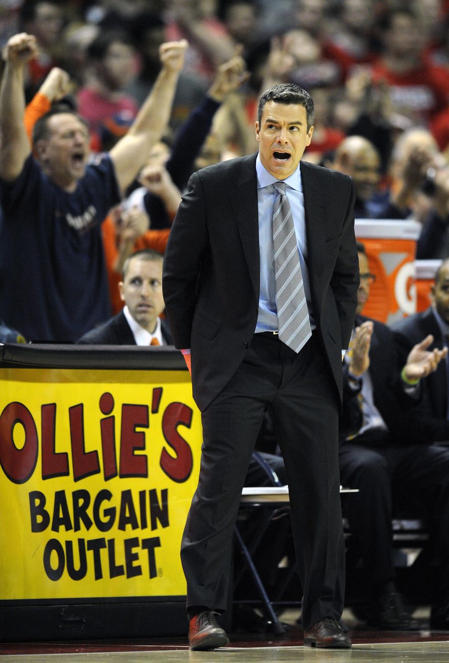 Virginia head coach Tony Bennett reacts during the second half of an NCAA college basketball game against Maryland, Sunday, March 9, 2014, in College Park, Md. Maryland won 75-69 in overtime. (AP Photo/Nick Wass)