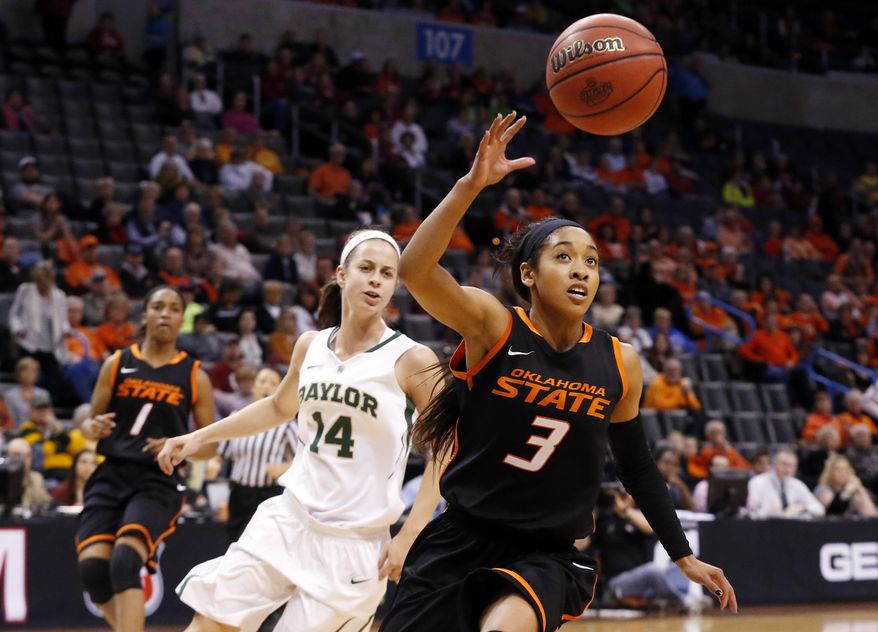 Oklahoma State guard Tiffany Bias (3) chases a loose ball in front of Baylor guard Makenzie Robertson (14) in the first half of an NCAA college basketball game in the semifinals of the Big 12 Conference women's college tournament in Oklahoma City, Sunday, March 9, 2014. Baylor won 65-61. (AP Photo/Sue Ogrocki)