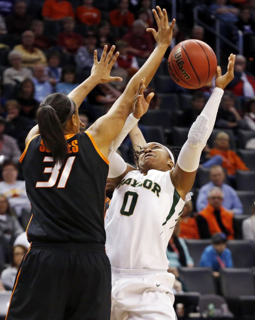 Baylor guard Odyssey Sims (0) shoots as Oklahoma State center Kendra Suttles (31) defends in the second half of an NCAA college basketball game in the semifinals of the Big 12 Conference women's college tournament in Oklahoma City, Sunday, March 9, 2014. Baylor won 65-61. (AP Photo/Sue Ogrocki)