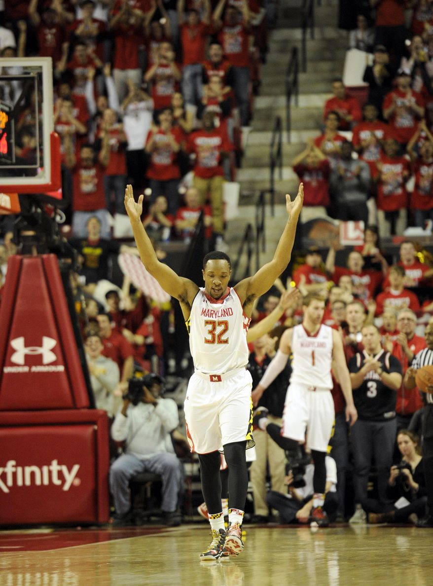 Maryland guard/forward Dez Wells (32) reacts during the second half of an NCAA college basketball game against Virginia, Sunday, March 9, 2014, in College Park, Md. Maryland won 75-69 in overtime. (AP Photo/Nick Wass)