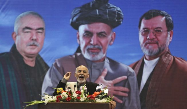Afghan presidential candidate Ashraf Ghani Ahmadzai speaks during a campaign rally for women a day after International Women&#x27;s Day in Kabul, Afghanistan, Sunday, March 9, 2014. Ten Afghan presidential candidates are campaigning in the presidential election scheduled for April. (AP Photo/Massoud Hossaini)