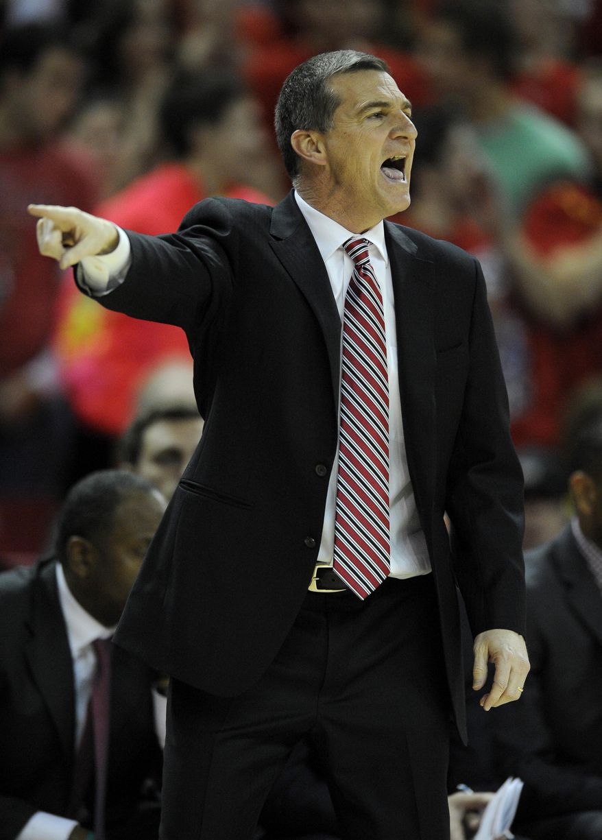 Maryland head coach Mark Turgeon points during the second half of an NCAA college basketball game against Virginia, Sunday, March 9, 2014, in College Park, Md. Maryland won 75-69 in overtime. (AP Photo/Nick Wass)