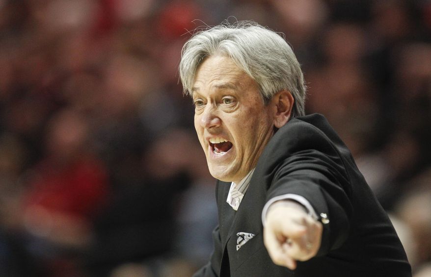 New Mexico coach Craig Neal tries to rally his team during the second half of New Mexico 51-48 loss to San Diego State in a NCAA college basketball game Saturday, March 8, 2014, in San Diego. The loss gave San Diego State the Mountain West Conference regular season championship. (AP Photo/Lenny Ignelzi )