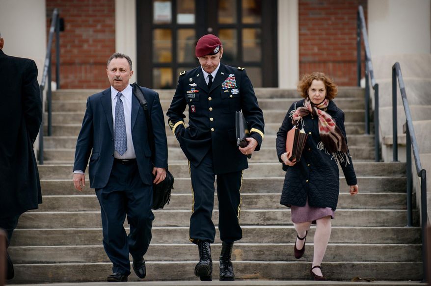 ** FILE ** In this March 4, 2014, file photo, Brig. Gen. Jeffrey Sinclair leaves the courthouse with his lawyers Richard Scheff, left, and Ellen C. Brotman, following a day of motions at Fort Bragg, N.C. (AP Photo/The Fayetteville Observer, James Robinson)