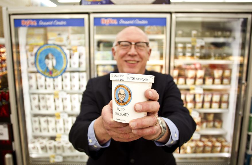 ADVANCE FOR USE SUNDAY, MARCH 9 - In this photo taken on Thursday, Feb. 27, 2014, stock broker turned frozen custard guru, David Gott holds a pint of his "David's Famous Gourmet" at the First Avenue Hy-Vee market in Iowa City, Iowa. (AP Photo/Iowa City Press-Citizen, Benjamin Roberts) NO SALES