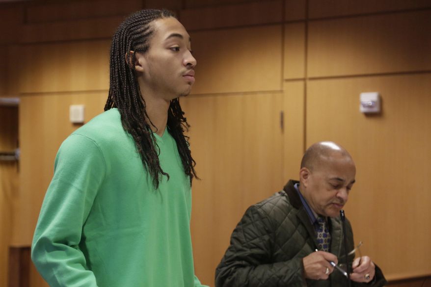 Cass Tech. student Jayru Campbell, represented by Walter Pookrum who is temporarily filling in for Campbell's main attorney Jeffrey Edison, is arraigned at the Frank Murphy Hall of Justice, Monday, March 10, 2014, in Detroit. Campbell is accused of body-slamming a school guard to the ground. (AP Photo/Detroit Free Press, Mandi Wright) DETROIT NEWS OUT; NO SALES; MANDATORY CREDIT