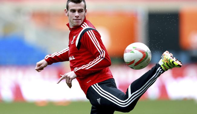 Wales&#x27; Gareth Bale during a training session with other members of the Wales soccer team at The Cardiff City Stadium, Cardiff, Wales, Tuesday March 4, 2014. Wales will play Iceland in a friendly soccer match Wednesday. (AP Photo/David Davies, PA) UNITED KINGDOM OUT - NO SALES - NO ARCHIVES