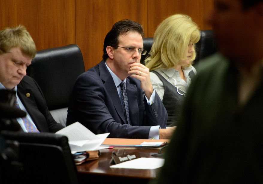 Rep. Pat Garofalo, second from left, attends a hearing of the House Energy Committee after he apologized for a tweet on Monday, March 10, 2014, in St. Paul, Minn. Garofalo suggested in a tweet Sunday night that pro basketball players have criminal tendencies. (AP Photo/The Star Tribune, Glen Stubbe) MANDATORY CREDIT; ST. PAUL PIONEER PRESS OUT; MAGS OUT; TWIN CITIES TV OUT