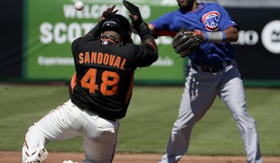 San Francisco Giants&#39; Pablo Sandoval is forced out by Chicago Cubs shortstop Emilio Bonifacio after Tony Abreu hit into a double play during the second inning of a spring exhibition baseball game in Scottsdale, Ariz., Monday, March 10, 2014. (AP Photo/Chris Carlson)
