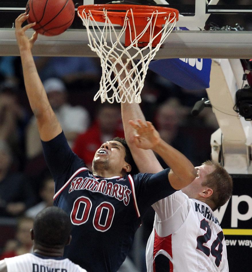 Saint Mary's Brad Waldow shoots covered by Gonzaga's Przemek Karnowski during the first half of a West Coast Conference tournament NCAA college basketball game, Monday, March 10, 2014, in Las Vegas. (AP Photo/Isaac Brekken)