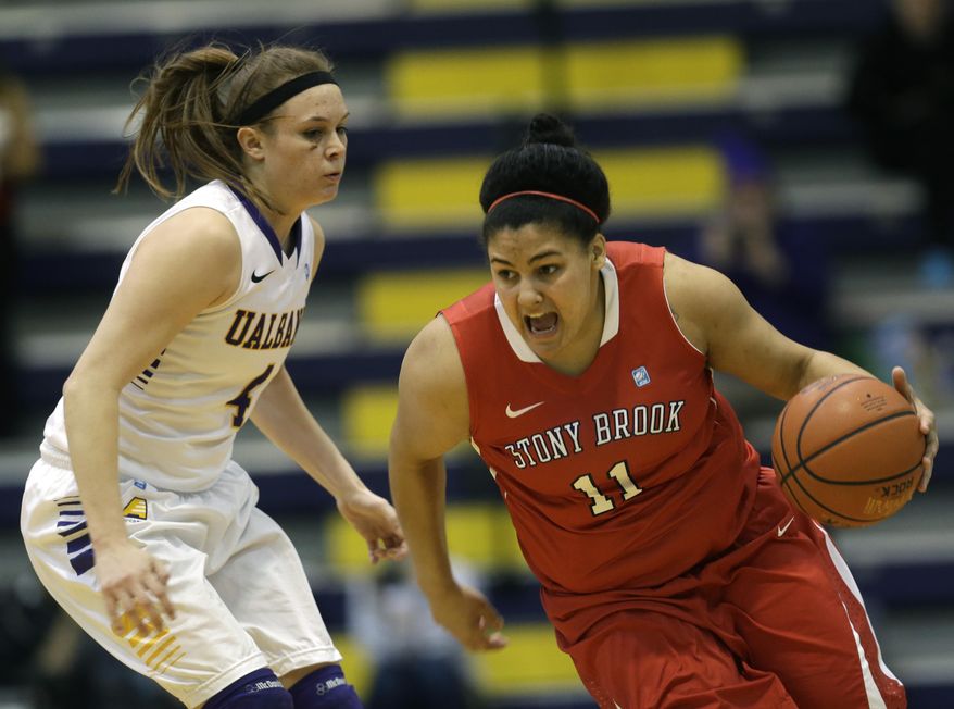 Stony Brook guard Kori Bayne-Walker (11) drives past Albany guard Sarah Royals (4) during the first half of an NCAA America East college championship basketball game on Monday, March 10, 2014, in Albany, N.Y. (AP Photo/Mike Groll)