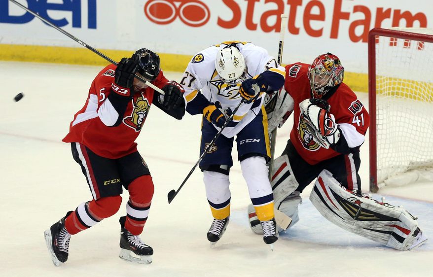 Otttawa Senators' Cody Ceci (5) ducks after being hit by the puck as Nashville Predators' Patric Hornqvist (27) ducks along with Ottawa Senators goaltender Craig Anderson (41) during the first period of an NHL game action, Monday, March 10, 2014, in Ottawa. Ceci was injuried on the play. (AP Photo/The Canadian Press, Fred Chartrand)