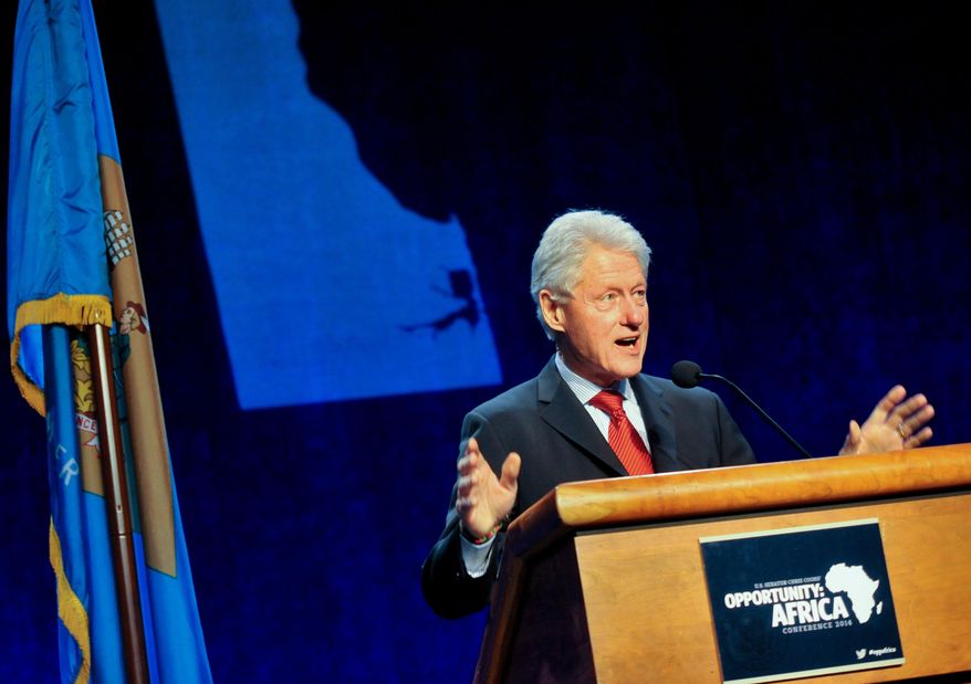 Former President Bill Clinton delivers remarks at an annual conference on Africa in Wilmington, Del., Monday, March 10, 2014. The conference brought together businesses, faith communities and individuals in Delaware with experts on Africa to discuss trade opportunities and issues such as human rights, sustainable development and global health. (AP Photo/Emily Varisco)