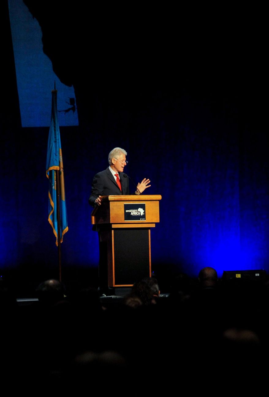 Former President Bill Clinton delivers remarks at an annual conference on Africa in Wilmington, Del., Monday, March 10, 2014. The conference brought together businesses, faith communities and individuals in Delaware with experts on Africa to discuss trade opportunities and issues such as human rights, sustainable development and global health. (AP Photo/Emily Varisco)