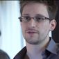 This photo provided by The Guardian Newspaper in London shows Edward Snowden, who worked as a contract employee at the National Security Agency, June 9, 2013, in Hong Kong. U.S. intelligence officials are planning an electronic monitoring system that would tap into government, financial and public databases to scan the behavior patterns of many of the 5 million government employees who hold secret clearances, according to current and former officials. The system draws on a Defense Department model in development for more than a decade, documents reviewed by the Associated Press show. (AP Photo/The Guardian, Glenn Greenwald and Laura Poitras)