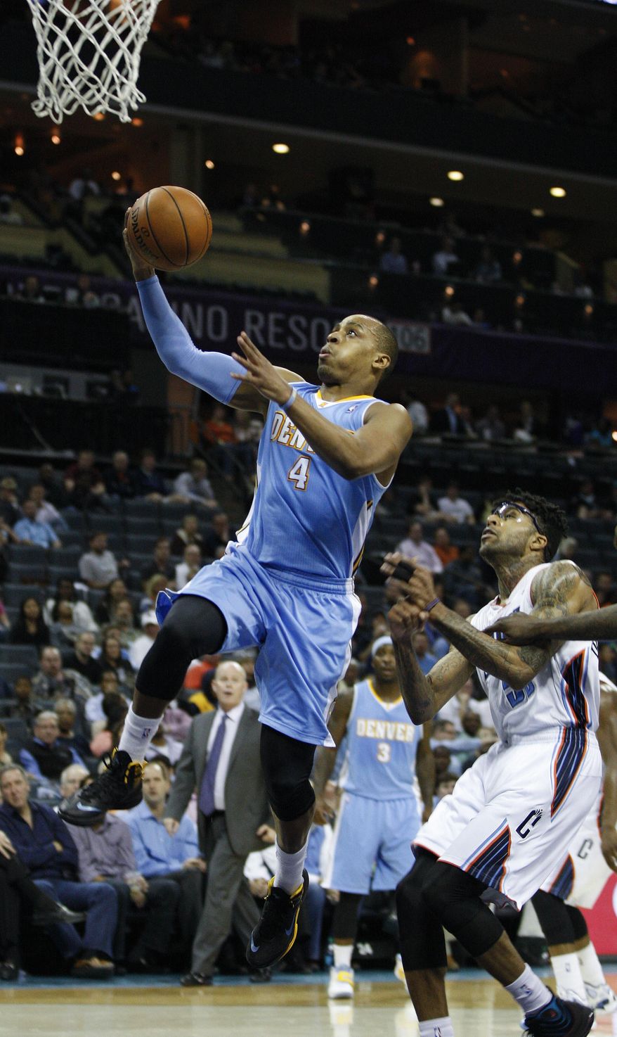 Denver Nuggets guard Randy Foye (4) scores against Charlotte Bobcats guard Chris Douglas-Roberts during the second half of an NBA basketball game in Charlotte, N.C., Monday, March 10, 2014. Charlotte won 105-98. (AP Photo/Nell Redmond)