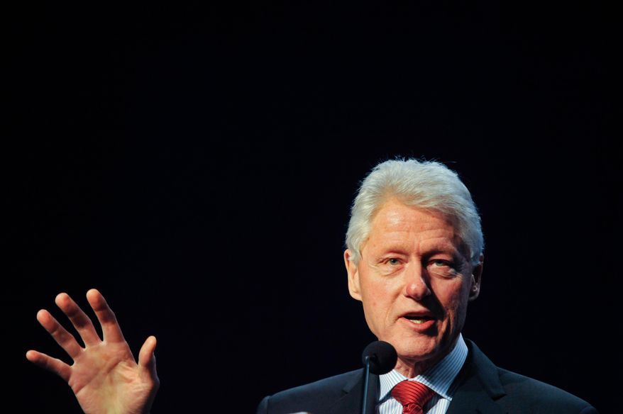 Former President Bill Clinton delivers remarks at an annual conference on Africa in Wilmington, Del., Monday, March 10, 2014. The conference brought together businesses, faith communities and individuals in Delaware with experts on Africa to discuss trade opportunities and issues such as human rights, sustainable development and global health. (AP Photo/Emily Varisco)