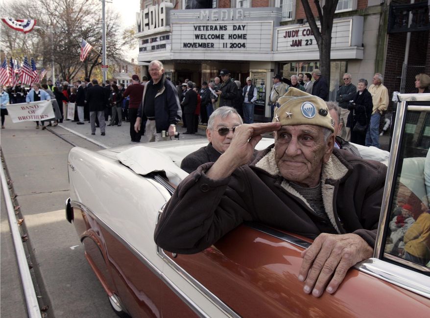 CORRECTS DAY DIED TO SATURDAY MARCH 8, 2014 FILE - This Nov. 11, 2004 file photo shows William "Wild Bill" Guarnere participating in the Veterans Day parade in Media, Pa. Guarnere, one of the World War II veterans whose exploits were dramatized in the TV miniseries "Band of Brothers," has died, Saturday, March 8, 2014, at the age of 90. (AP Photo/Jacqueline Larma, file)