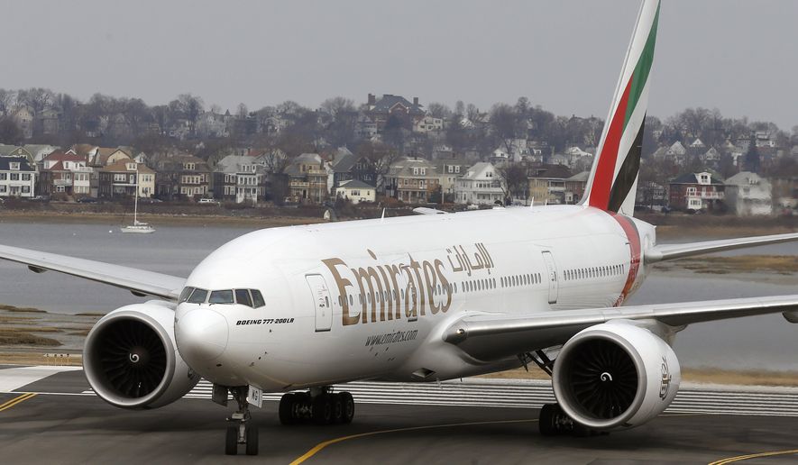 An Emirates Airlines Boeing 777 arrives at Logan International Airport in Boston, Monday, March 10, 2014. Emirates Airlines launched daily service between Boston and Dubai on Monday afternoon. (AP Photo/Michael Dwyer)