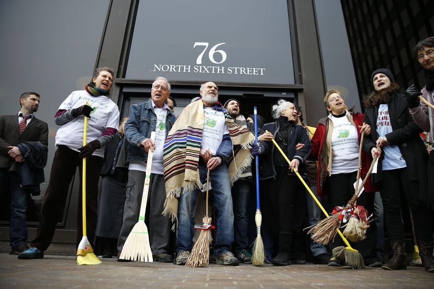 Protesters demonstrated in opposition to the proposed Keystone XL oil pipeline, Monday, March 10, 2014, outside the Federal Building in Philadelphia. The protestors say the pipeline would contribute to global warming. (AP Photo/Matt Rourke)