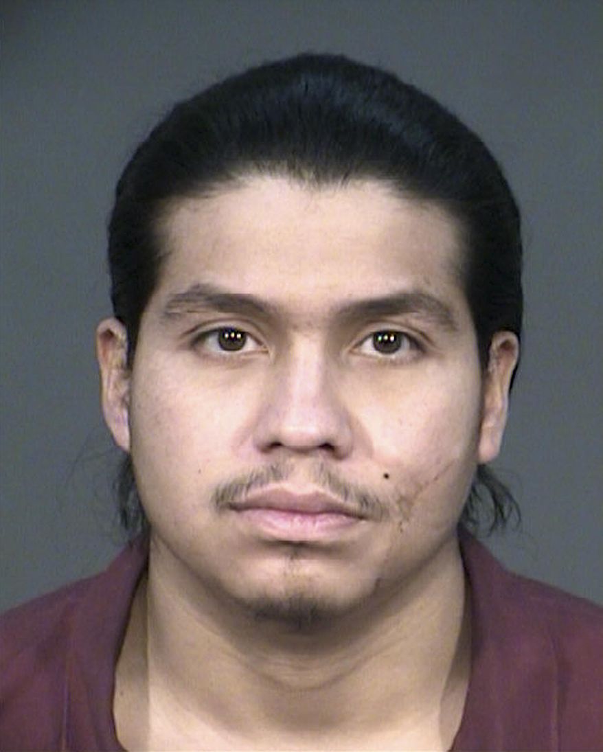 This undated photo released by the Fresno Police Department shows Sergio Patrick Rodriguez. Rodriguez, a central California man convicted of pointing a high-powered laser at a police helicopter, was sentenced Monday, March 10, 2014, to spend 14 years in federal prison. Rodriguez, a 26-year-old Clovis resident, was accused of pointing a green laser 13 times more powerful than common pointers at a Fresno Police Department helicopter in 2012. (AP Photo/Fresno Police Department)