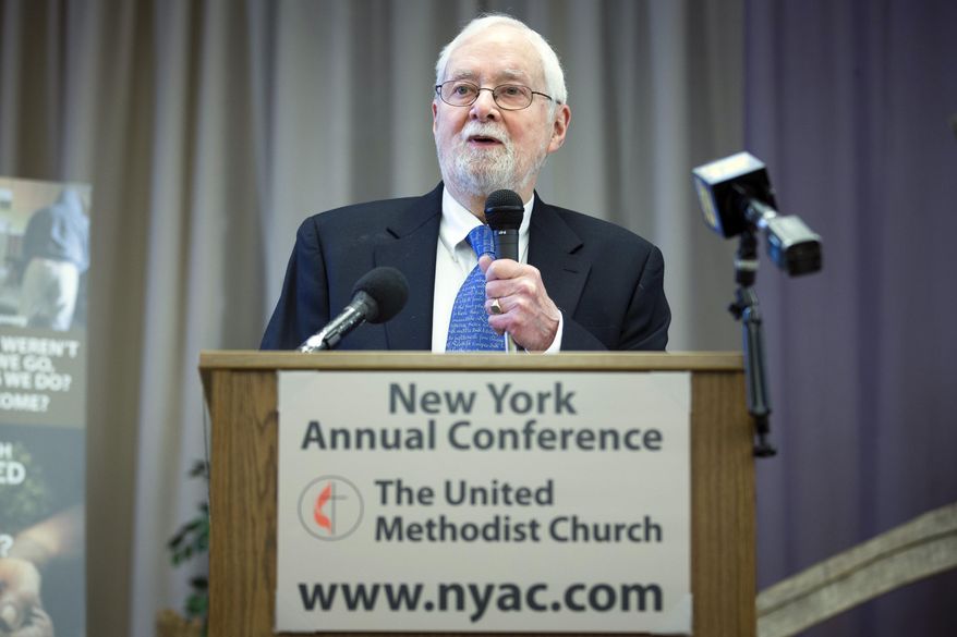 Rev. Thomas Ogletree speaks to the media during a news conference following the announcement that a case against him for breaking church law by officiating his son's same-sex marriage had been dropped, Monday, March 10, 2014, in White Plains, N.Y. Ogletree, 80, said he's grateful the church had decided not to prosecute him for what he called "an act of pastoral faithfulness and fatherly love." (AP Photo/John Minchillo)