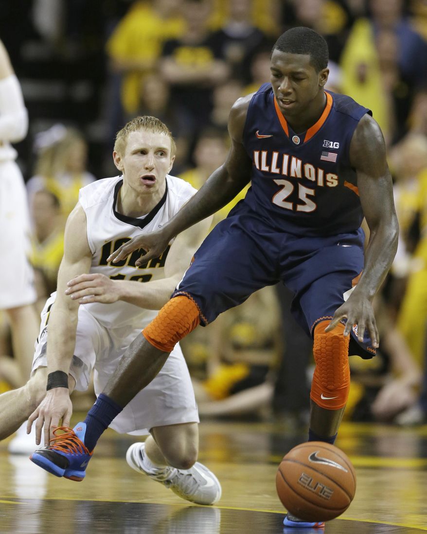 Illinois guard Kendrick Nunn, right, drives past Iowa guard Mike Gesell during the second half of an NCAA college basketball game on Saturday, March 8, 2014, in Iowa City, Iowa. Illinois won 66-63. (AP Photo/Charlie Neibergall)