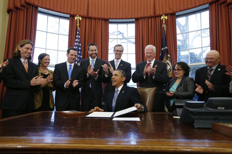 President Barack Obama finishes signing a document proclaiming the Point Arena-Stornetta Public Lands as part of the California Coastal National Monument during a signing ceremony in the Oval Office of the White House in Washington, Tuesday, March 11, 2014. From left are: Scott Schneider, President and CEO, Visit Mendocino County Inc.; Leslie Dahlhoff, Former Mayor, Point Arena; Michael Boots, Acting Chair of the Council on Environmental Quality; Neil Kornze, Principal Deputy Director, Bureau of Land Management; Rep. Jared Huffman, D-Calif.; Rep. Mike Thompson, D-Calif.; Nancy Sutley, Former Chair of the Council on Environmental Quality. (AP Photo/Charles Dharapak)