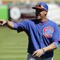 Chicago Cubs shortstop Javier Baez warms up before a spring exhibition baseball game against the San Francisco Giants in Scottsdale, Ariz., Monday, March 10, 2014. (AP Photo/Chris Carlson)